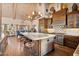 Gourmet kitchen with large island, stainless steel appliances, and custom cabinetry at 8514 E Country Club Trl, Scottsdale, AZ 85255