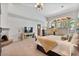 Spacious main bedroom boasts a fireplace, high ceilings, large windows, and access to outdoor views at 8514 E Country Club Trl, Scottsdale, AZ 85255