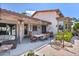 Charming outdoor patio with comfortable seating, dining area, and a relaxing atmosphere at 8514 E Country Club Trl, Scottsdale, AZ 85255