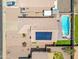 Birds eye view of home with solar panels, pool and neutral landscaping in residential area at 8657 E Capri Ave, Mesa, AZ 85208