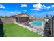 Backyard with swimming pool and a covered patio provides an inviting outdoor space at 8657 E Capri Ave, Mesa, AZ 85208
