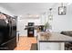 Bright kitchen with white cabinetry, granite countertops, and modern appliances at 8657 E Capri Ave, Mesa, AZ 85208