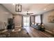 Inviting living room with natural light, modern ceiling fan, and easy access to outdoor living at 8657 E Capri Ave, Mesa, AZ 85208