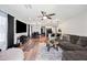 Spacious living area featuring a mix of tile and wood flooring, open to dining and kitchen at 8657 E Capri Ave, Mesa, AZ 85208