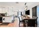 Open-concept living space with dining area, kitchen, and a cozy living room setup at 8657 E Capri Ave, Mesa, AZ 85208