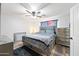 Spacious main bedroom features a decorative bed frame and ample storage at 8657 E Capri Ave, Mesa, AZ 85208