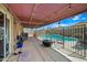 Covered patio overlooking a sparkling pool, perfect for outdoor entertaining and relaxation at 8657 E Capri Ave, Mesa, AZ 85208