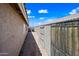 Side yard view showcases the home's exterior with an alleyway, blending function and design at 8657 E Capri Ave, Mesa, AZ 85208