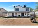 Spacious backyard featuring a covered patio, grill, and ample space for outdoor activities at 9026 W Cambridge Ave, Phoenix, AZ 85037