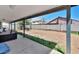 Spacious backyard featuring a block fence, patio area, and outdoor grill at 9026 W Cambridge Ave, Phoenix, AZ 85037
