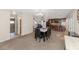 Open dining area with a large table, seamlessly connecting to the kitchen and living room at 9026 W Cambridge Ave, Phoenix, AZ 85037