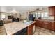 Kitchen area with bar seating, stainless steel sink, and plenty of counter space at 9026 W Cambridge Ave, Phoenix, AZ 85037