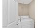 View of a laundry room featuring a white washer and dryer with open door at 9026 W Cambridge Ave, Phoenix, AZ 85037
