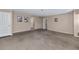 Spacious living room with neutral color palette and comfortable carpeting at 9026 W Cambridge Ave, Phoenix, AZ 85037