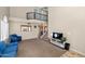 Spacious living room featuring a loft, carpeted floors, and a view of the kitchen at 9026 W Cambridge Ave, Phoenix, AZ 85037