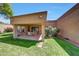Lush backyard showcases covered patio, perfect for outdoor dining with ample seating and greenery at 9512 W Mcrae Way, Peoria, AZ 85382
