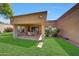 Lush backyard showcases covered patio, perfect for outdoor dining with ample seating and greenery at 9512 W Mcrae Way, Peoria, AZ 85382