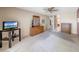 Spacious carpeted bedroom with neutral walls, a ceiling fan, and a view into the bathroom at 9512 W Mcrae Way, Peoria, AZ 85382