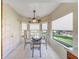 Bright and airy dining area with large windows and a view of the outside at 9512 W Mcrae Way, Peoria, AZ 85382