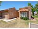 Inviting front exterior showcasing a well-manicured lawn, desert landscaping, and a tile roof at 9512 W Mcrae Way, Peoria, AZ 85382