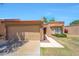 Charming home featuring a tile roof, well-maintained lawn, and inviting curb appeal on a sunny day at 9512 W Mcrae Way, Peoria, AZ 85382