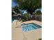 Inviting hot tub next to pool, ideal for relaxation with a shaded spot, enhancing the outdoor experience at 9512 W Mcrae Way, Peoria, AZ 85382