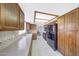 Spacious kitchen with modern appliances, wooden cabinetry, and ample counter space at 9512 W Mcrae Way, Peoria, AZ 85382