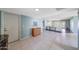 Bright, open-concept living area with tile flooring and views to the dining and living rooms at 9512 W Mcrae Way, Peoria, AZ 85382