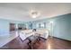 Bright living room with modern flooring, large sofa, and plenty of natural light at 9512 W Mcrae Way, Peoria, AZ 85382