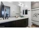 Bathroom with double vanity, dark cabinets, and modern fixtures, offering a clean and functional design at 100 W Northern Ave # 8, Phoenix, AZ 85021
