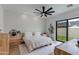 Bright bedroom with a minimalist design, featuring light wood furniture and access to an outdoor patio at 100 W Northern Ave # 8, Phoenix, AZ 85021