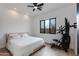 A modern bedroom features a neutral color scheme and an exercise machine for a functional living space at 100 W Northern Ave # 8, Phoenix, AZ 85021