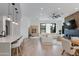 Open-concept living room featuring hardwood floors, modern lighting, and comfortable seating at 100 W Northern Ave # 8, Phoenix, AZ 85021