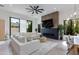 Living room with wood floors, a modern ceiling fan, and a fireplace at 100 W Northern Ave # 8, Phoenix, AZ 85021