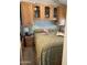 Bedroom with a queen size bed, overhead cabinets, and side table at 1001 S Prospector Dr # 1001, Apache Junction, AZ 85119