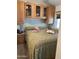 Bedroom with a queen size bed, overhead cabinets, and side table at 1001 S Prospector Dr # 1001, Apache Junction, AZ 85119