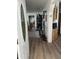 Inviting entryway featuring hardwood floors, elegant decor, and a partial view of the kitchen at 1001 S Prospector Dr # 1001, Apache Junction, AZ 85119