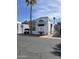 Inviting single-story home with a carport, decorated with flamingo lawn ornaments at 1001 S Prospector Dr # 1001, Apache Junction, AZ 85119