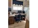 Corner office space with built-in desk, drawers, chair, and natural light from window at 1001 S Prospector Dr # 1001, Apache Junction, AZ 85119