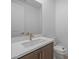 Stylish half bathroom featuring a modern vanity, quartz countertop, and a sleek single basin sink at 10224 E Utah Ave, Mesa, AZ 85212