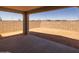 A covered patio featuring a concrete flooring, providing a comfortable space for outdoor relaxation and entertainment at 10224 E Utah Ave, Mesa, AZ 85212