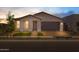 Inviting single-story home with a neutral stucco exterior and well-maintained front yard at 10224 E Utah Ave, Mesa, AZ 85212