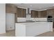 Gourmet kitchen featuring stainless steel appliances, a large island, and sleek cabinetry at 10224 E Utah Ave, Mesa, AZ 85212