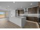 Spacious kitchen with a large island, stainless steel appliances, and open floor plan at 10224 E Utah Ave, Mesa, AZ 85212