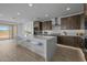 Kitchen with stainless steel appliances, a large island, and comfortable barstool seating at 10224 E Utah Ave, Mesa, AZ 85212