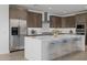 Modern kitchen with stainless steel appliances, spacious island, and stylish seating at 10224 E Utah Ave, Mesa, AZ 85212