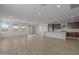 Open-concept living space with hardwood floors, a kitchen island and recessed lighting at 10224 E Utah Ave, Mesa, AZ 85212