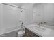 This bathroom has a shower/bathtub combo, white counters, and a large mirror above the sink at 10230 E Utah Ave, Mesa, AZ 85212