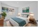 Staged bedroom with neutral carpeting, baseboards, and a single window at 10230 E Utah Ave, Mesa, AZ 85212
