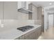 Modern kitchen features stainless steel appliances, quartz countertops, neutral backsplash and gray cabinetry at 10230 E Utah Ave, Mesa, AZ 85212